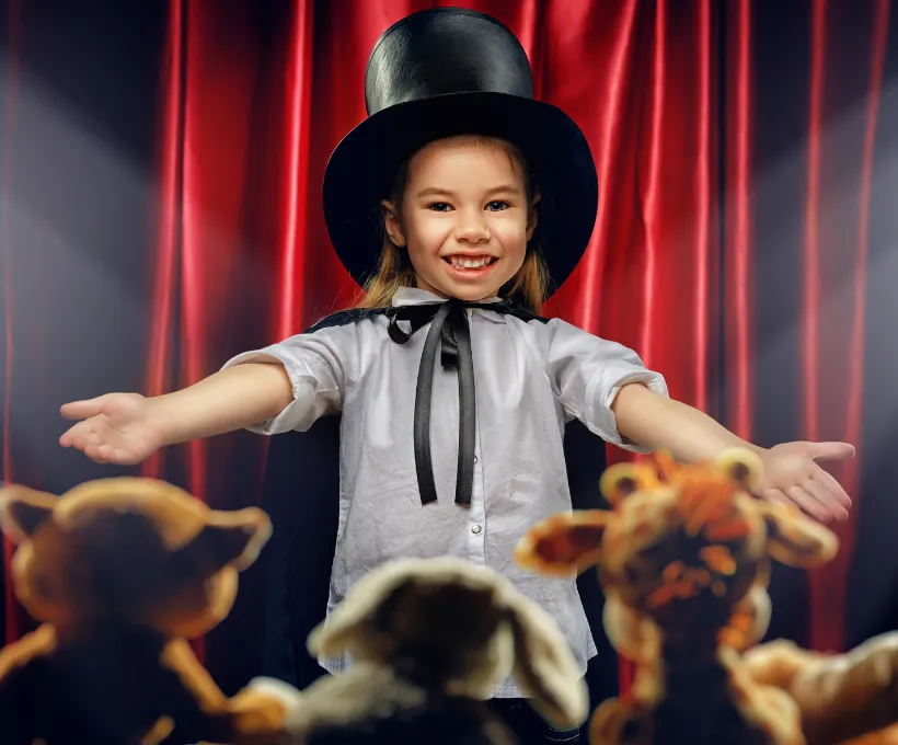 Kid Showing Magic To Soft Toys